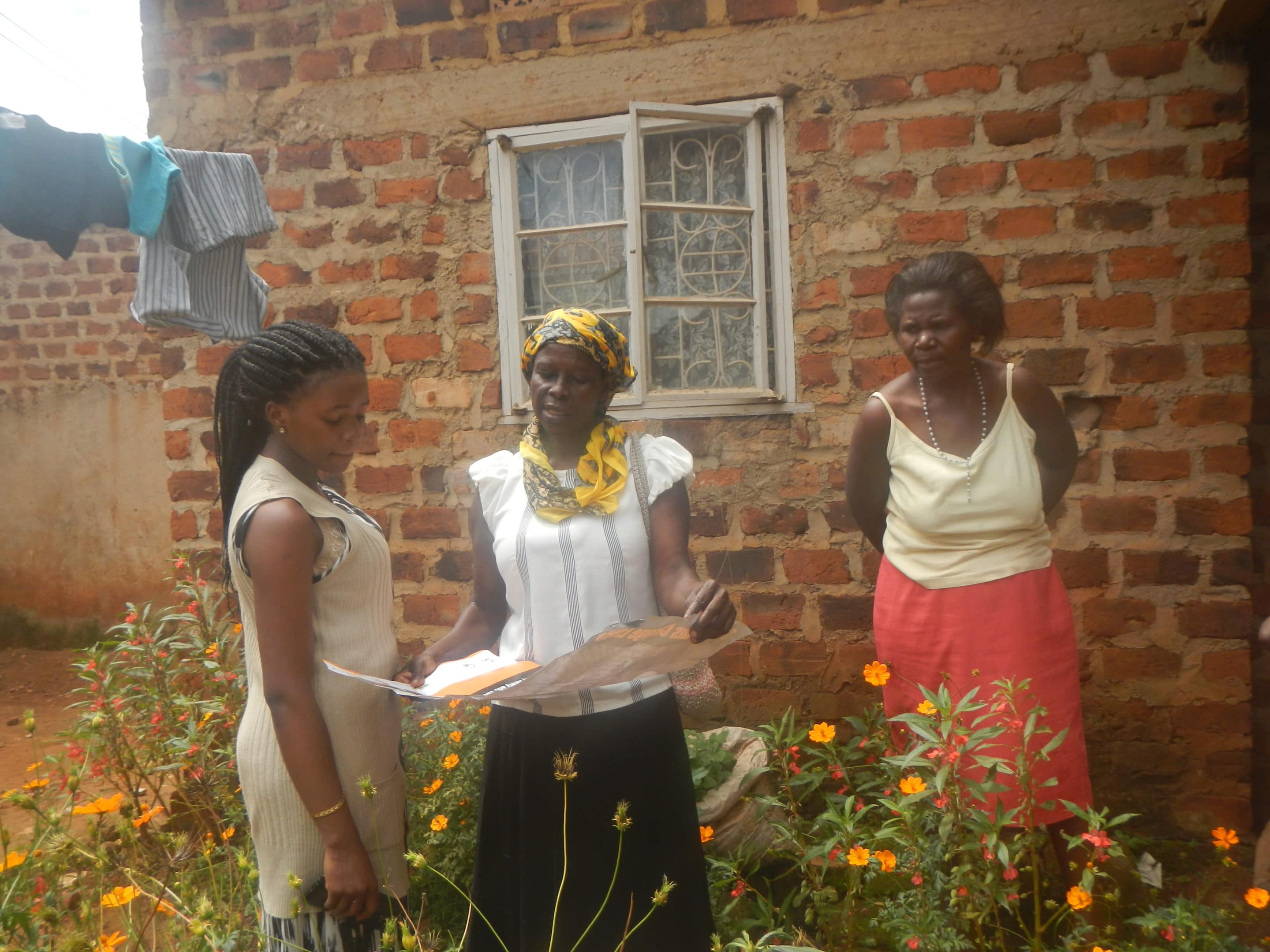 Ruth Kibalama educating women in community woman's solar empowerment