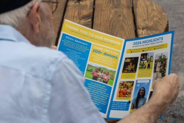 Reading about our Impact at the 2025 Solar Celebration