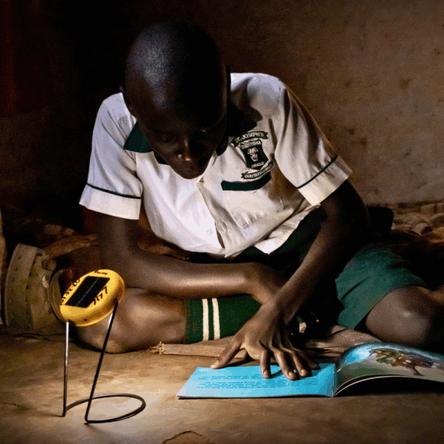 St. Sentema student using his new solar light to read